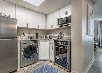 The Indigo |Clearwater, FL | Kitchenappliances and white cabinets.